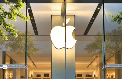 Golden apple store facade reflections
